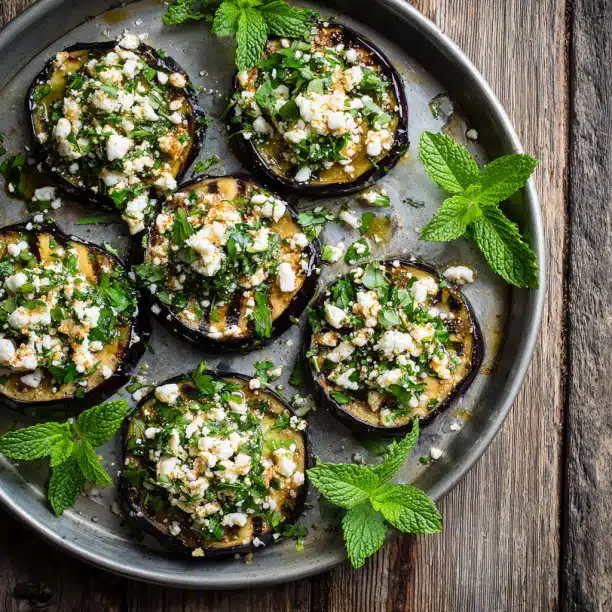 Grilled Eggplant with Garlic-Cumin Vinaigrette, Feta, and Herbs