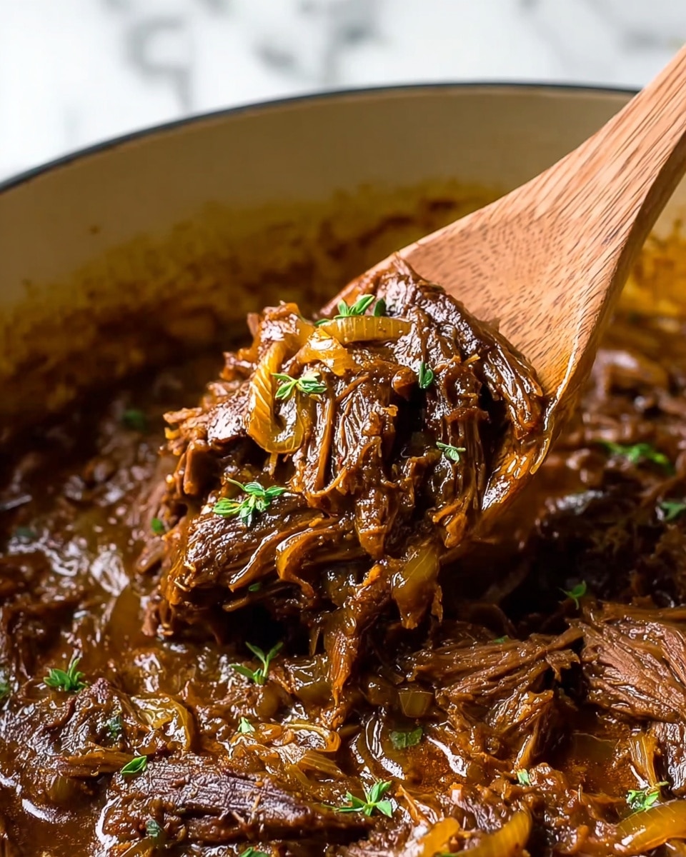 A shallow white bowl holds two layers of food on a white marbled surface; the bottom layer is a thick, creamy mound of pale yellow mashed potatoes with a slightly rough texture and soft peaks around the edges, on top of which sits a rich, dark brown layer of shredded meat mixed with thick gravy that glistens under the light. Small bits of green herbs are sprinkled on the meat and mashed potatoes, adding contrast and freshness to the warm, hearty dish. photo taken with an iphone --ar 4:5 --v 7