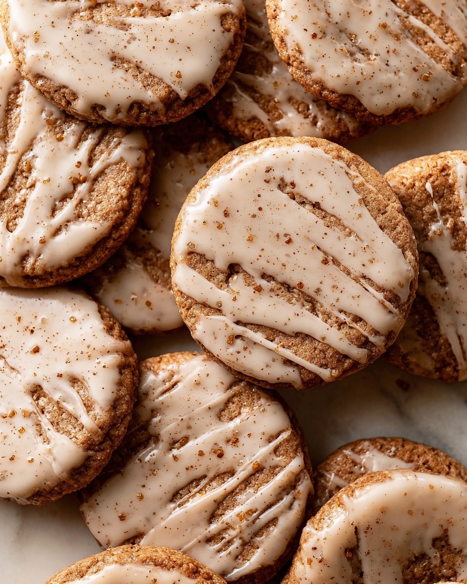 A stack of five square oat bars is shown on a white marbled surface, each bar thick with a rough, crumbly texture. The bars have a warm, golden-brown color with visible oats and small bits inside. A light beige glaze is drizzled over the top of each layer, slightly dripping down the sides. The bars are neatly stacked, with the top bar partially broken, showing the dense oat filling inside. photo taken with an iphone --ar 4:5 --v 7