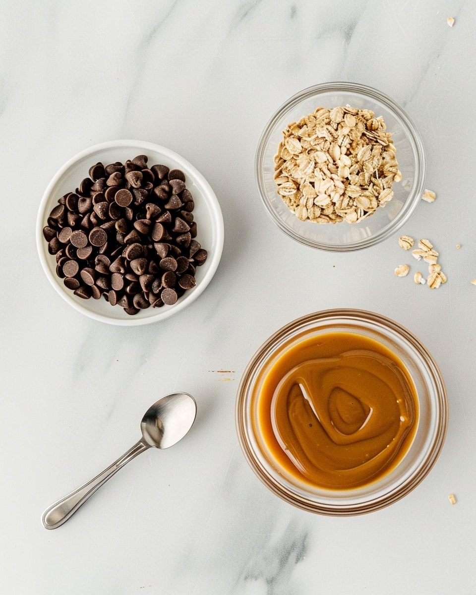 Single white plate with one oatmeal and chocolate chip energy ball, close-up showing the textured oats and scattered chocolate chips embedded throughout the round shape, soft natural lighting highlighting the chewy interior texture, placed on white marble surface, intimate plated serving photo taken with an iphone --ar 4:5 --v 7