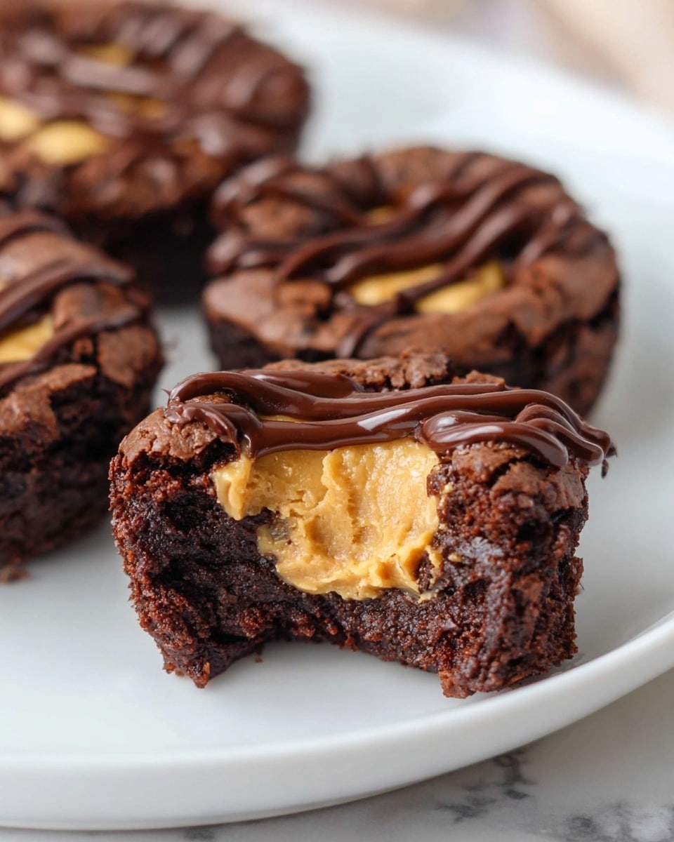 White serving platter filled with an array of freshly baked chocolate brownie cups, each topped with a generous swirl of creamy peanut butter and elegantly drizzled with rich dark chocolate, arranged neatly to display the entire assortment, photographed from a 3/4 angle on a white marble countertop with natural lighting, professional food styling photo taken with an iphone --ar 4:5 --v 7