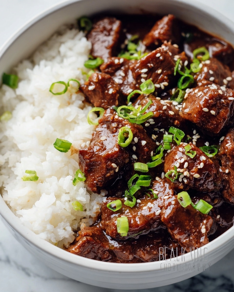 Large white serving bowl filled with rich beef stew, tender chunks of beef smothered in a thick, hearty brown gravy with visible specks of sesame seeds and chopped green onions sprinkled on top, accompanied by a full stainless steel bowl of fluffy white rice, whole dish showcased from a 3/4 angle on a white marble countertop, professional food magazine hero shot with natural lighting, photo taken with an iphone --ar 4:5 --v 7